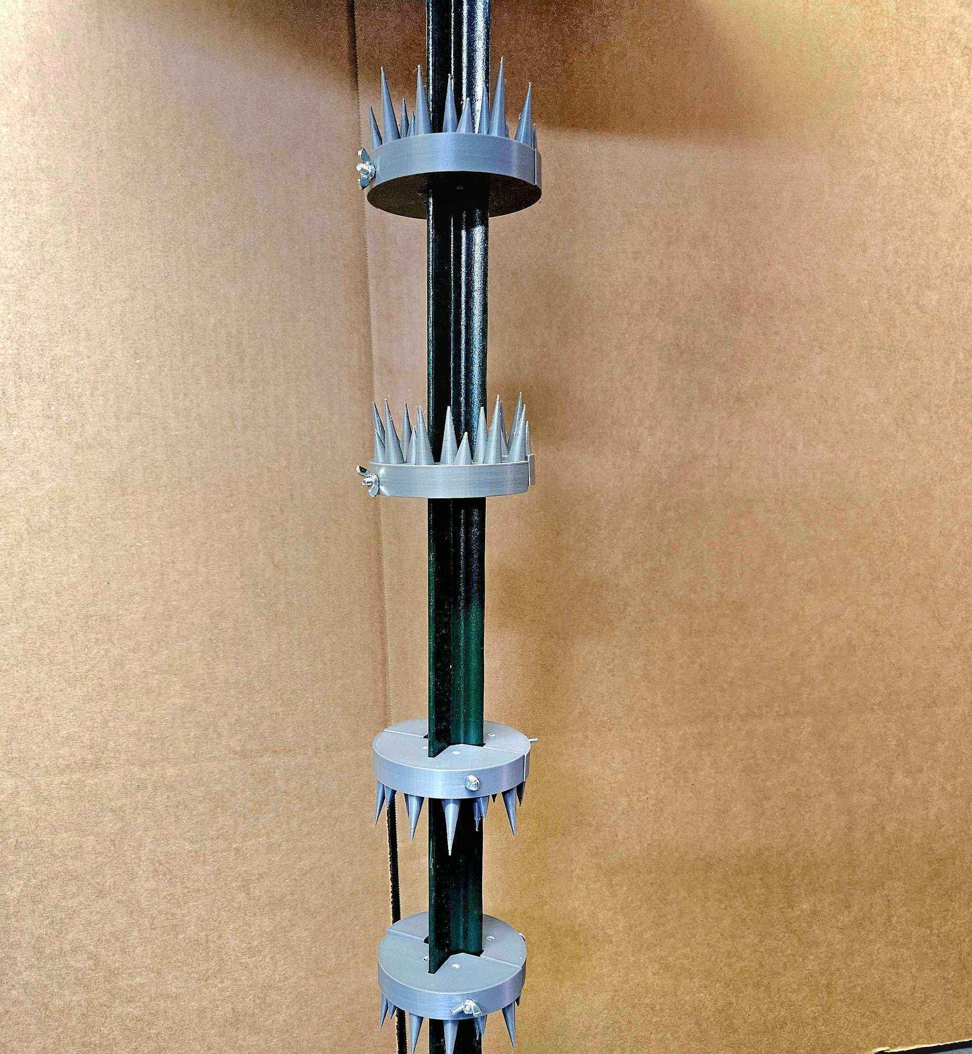 Coon Claw by AirBoss multiple raccoon deterrent claws installed on feeder pole
