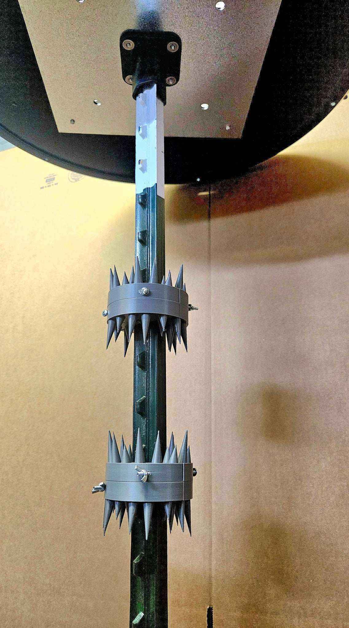 Coon Claw by AirBoss raccoon deterrent mounted under deer feeder bottom view